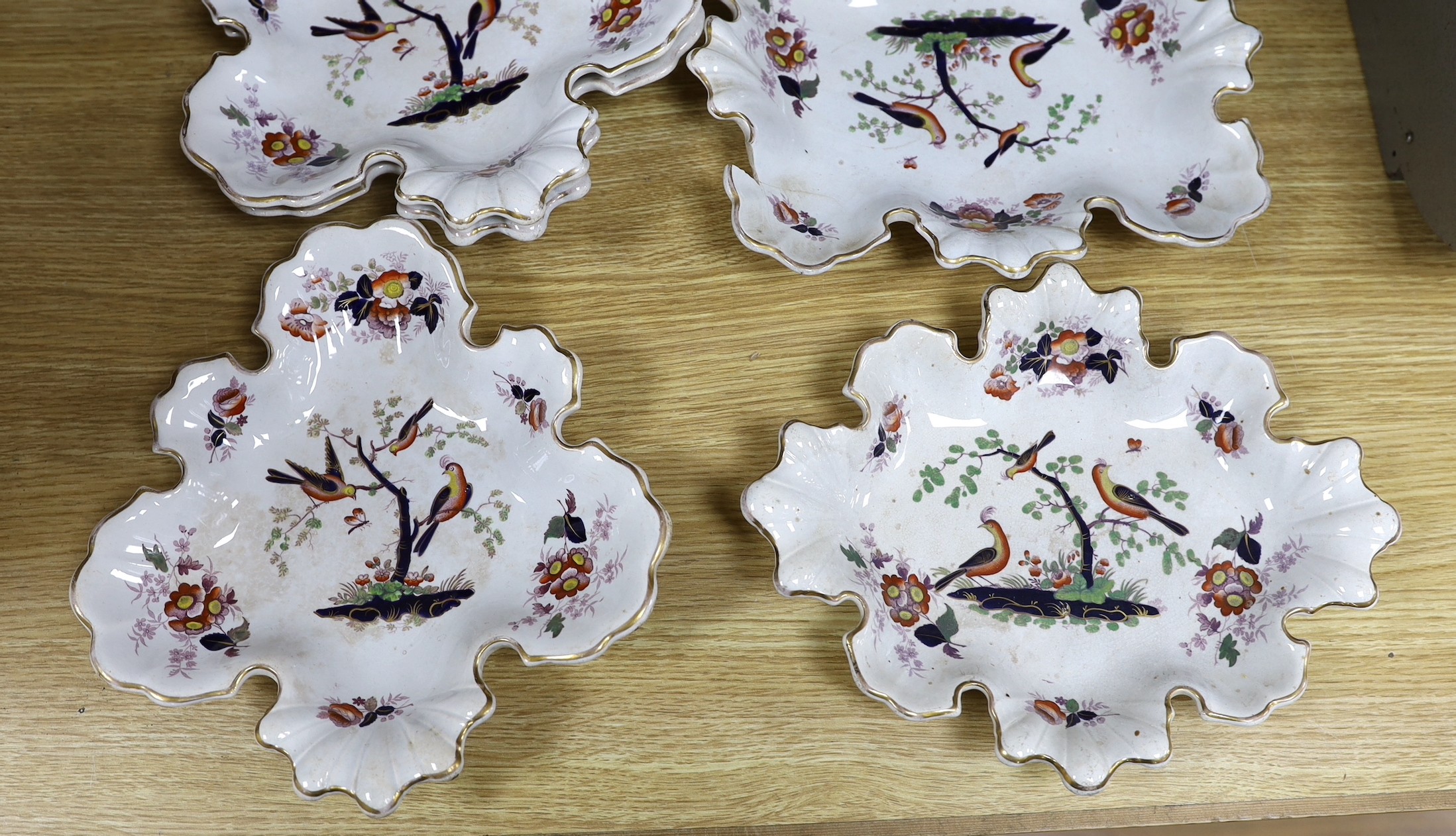 A mid 19th century opaque china dessert service by W. Baker & Co.